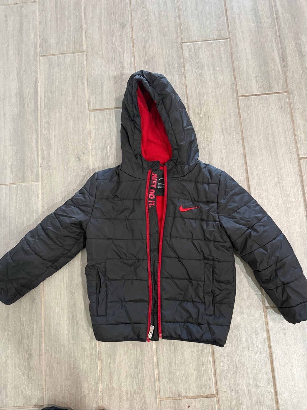 Nike Black Puffer Jacket with Red Accents and Hood